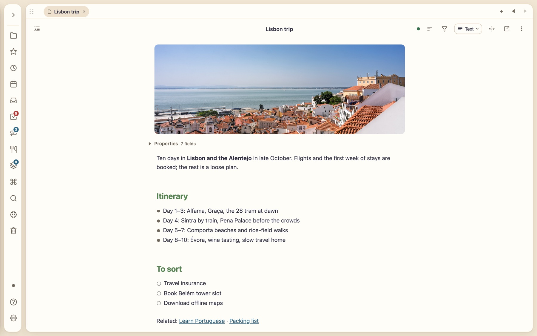 A note called Lisbon trip with a banner photo of Lisbon rooftops, an itinerary and a checklist